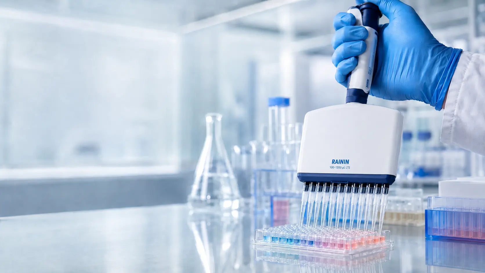 ABMIUM scientist handling a sample tube in a laboratory